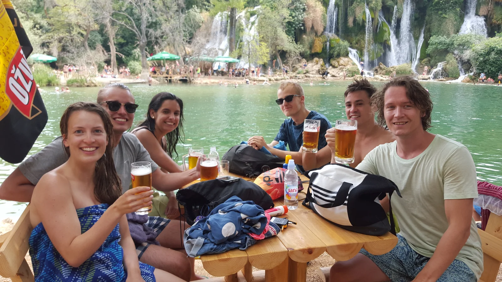 Guests swimming at the base of Kravica Waterfall