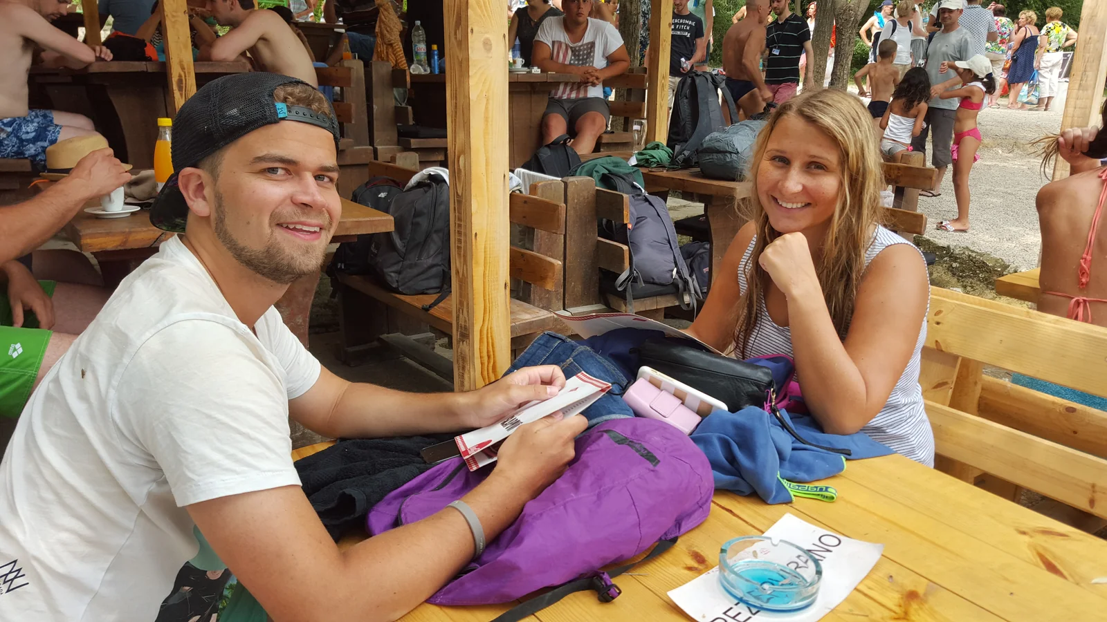 Guests swimming at the base of Kravica Waterfall