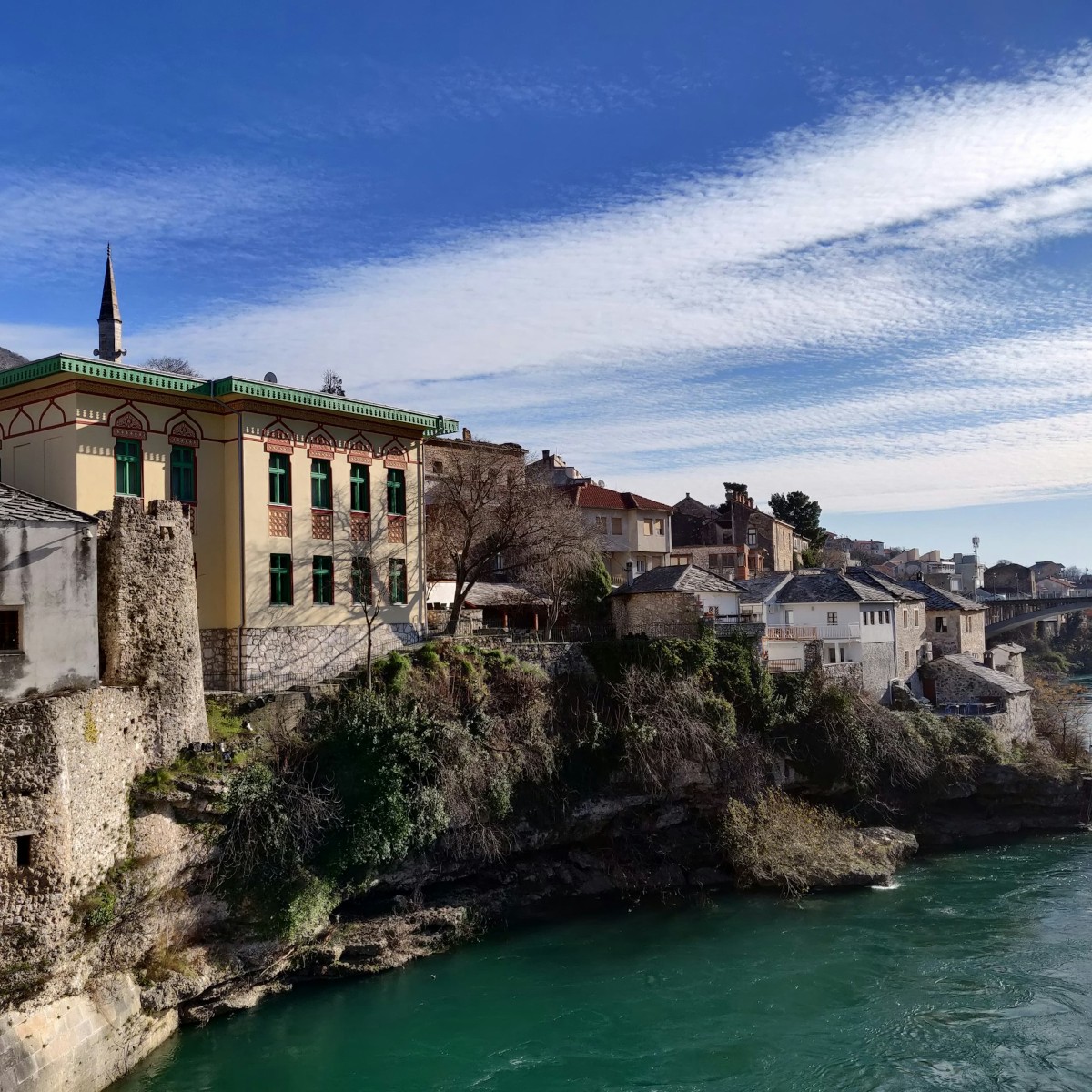 Mostar old town cobbled lane lined with copper workshops